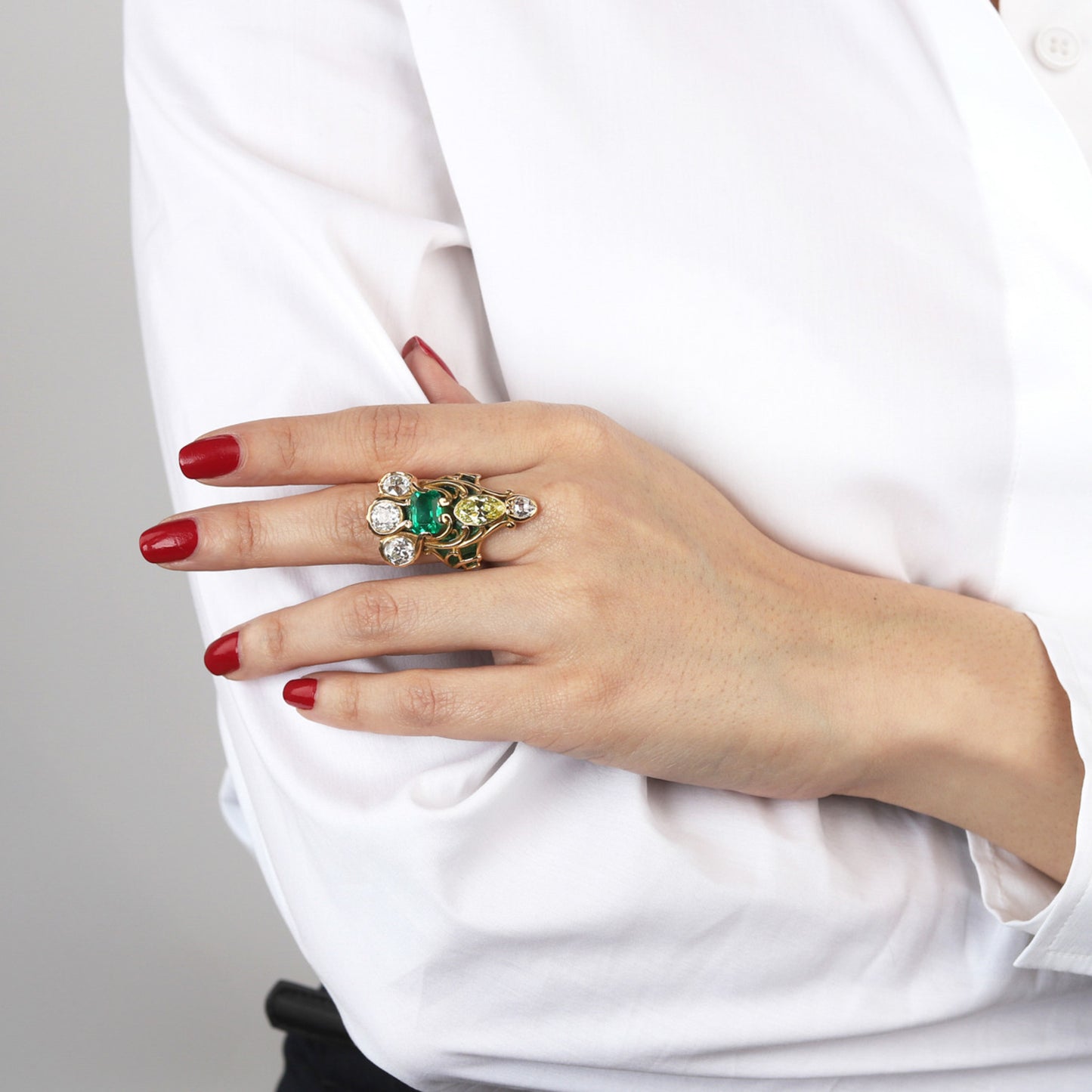Marcus & Co. Art Nouveau 18KT Yellow Gold Emerald, Diamond & Enamel Ring on finger