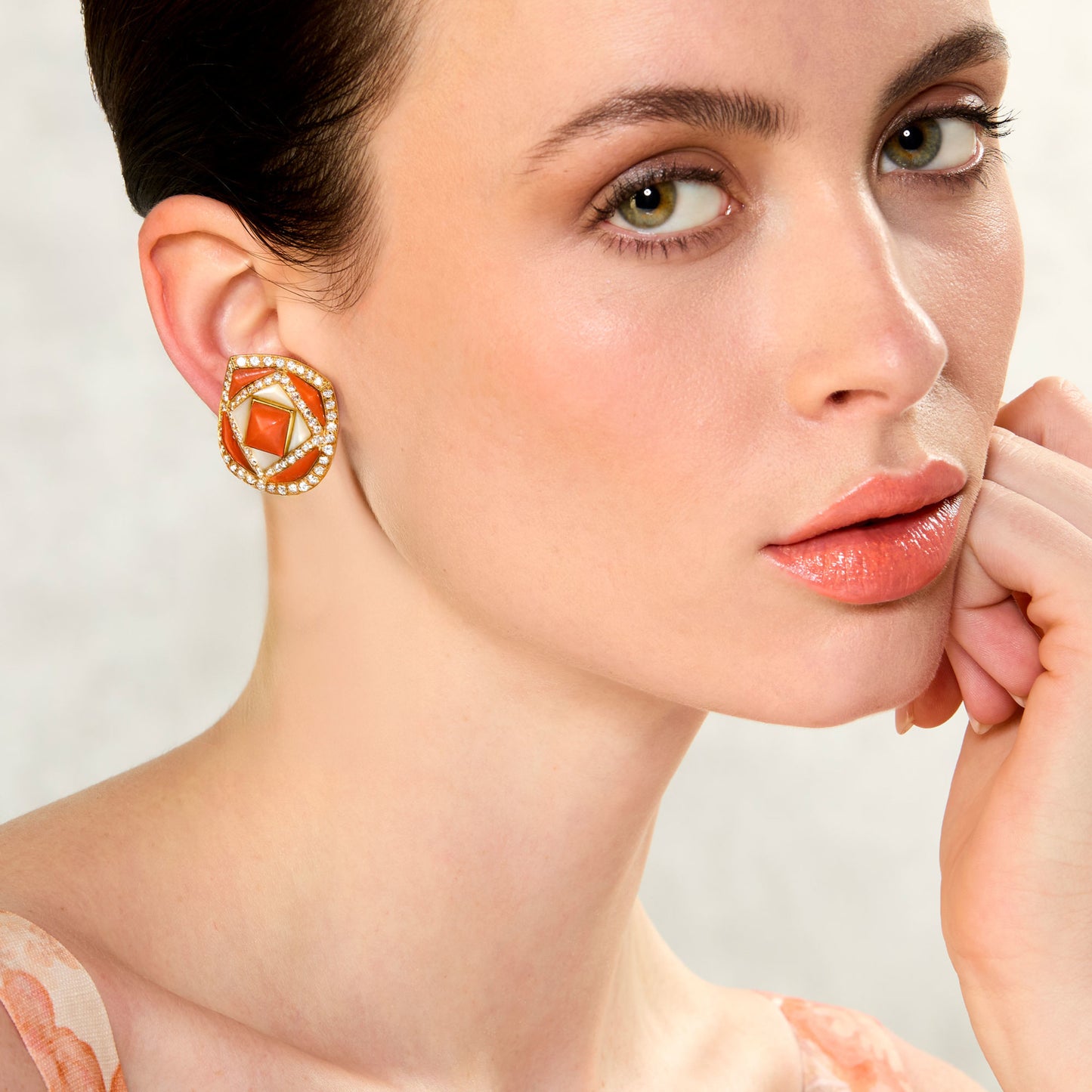 Bulgari 1980s 18KT Yellow Gold Coral, Diamond & Mother of Pearl Earrings on ear