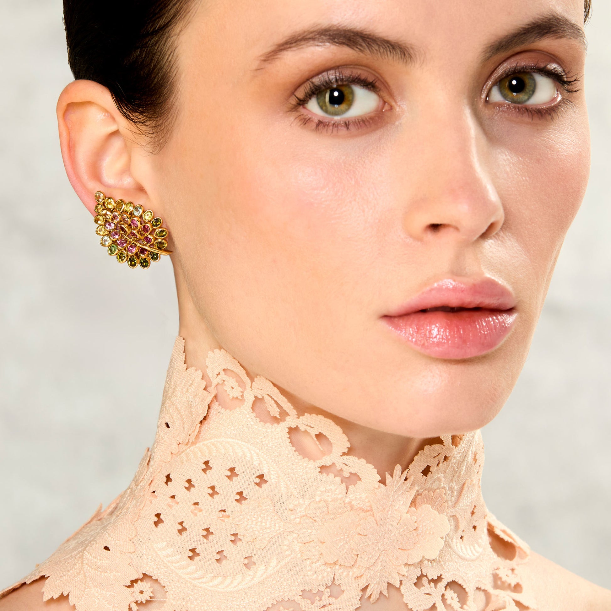 Rene Boivin 1950s 18KT Yellow Gold Sapphire Feuilles Earrings on ear