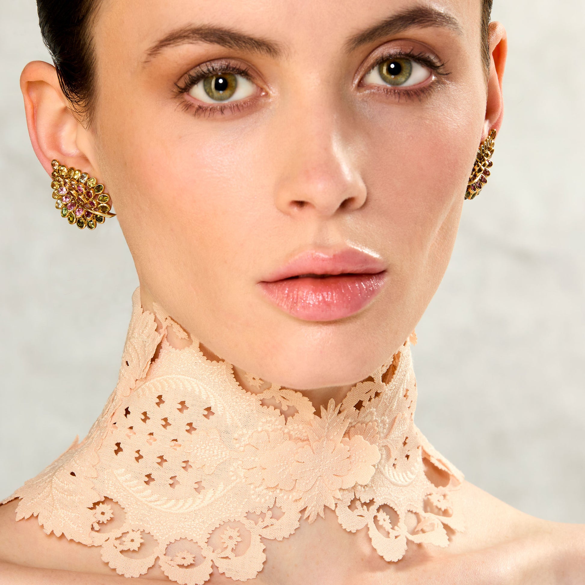Rene Boivin 1950s 18KT Yellow Gold Sapphire Feuilles Earrings on ear