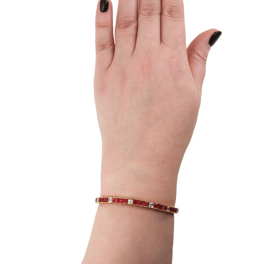 1970s 18KT Yellow Gold Ruby & Diamond Bracelet on wrist