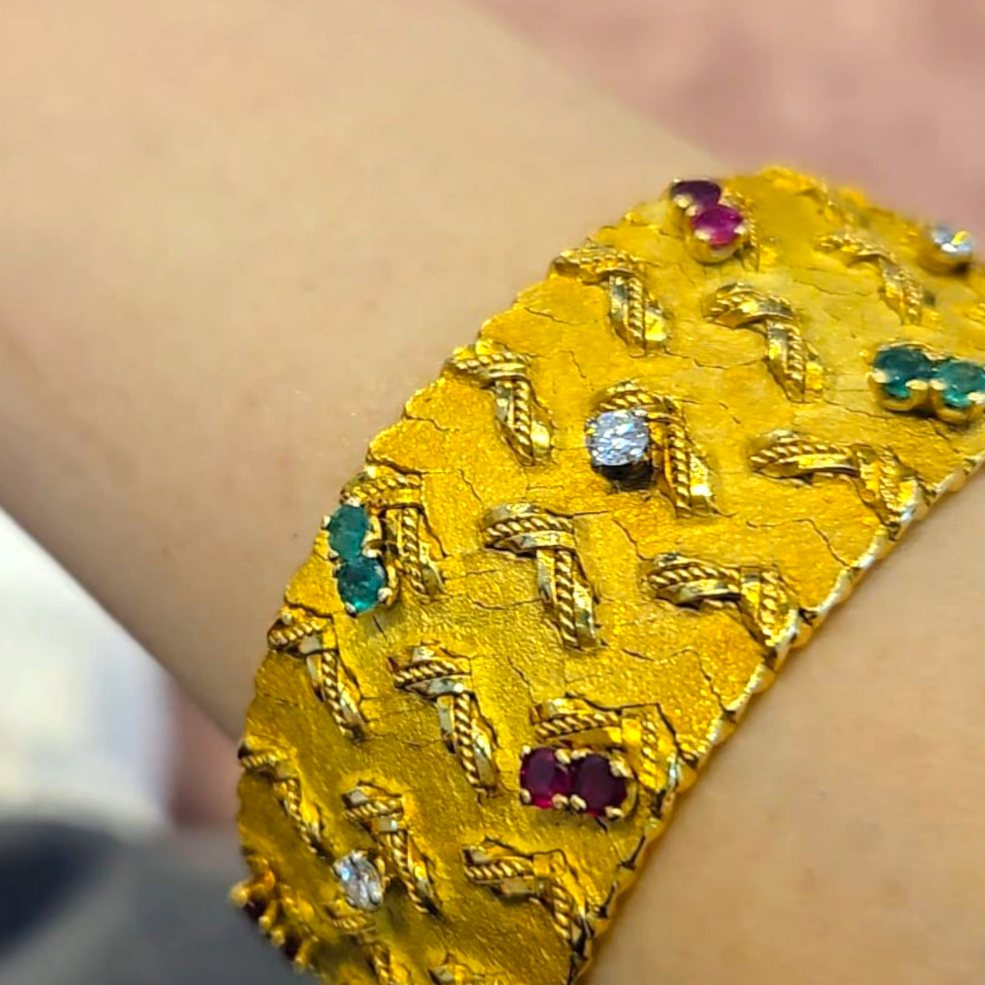 French 1960s 18KT Yellow Gold Diamond, Emerald & Ruby Bracelet on wrist