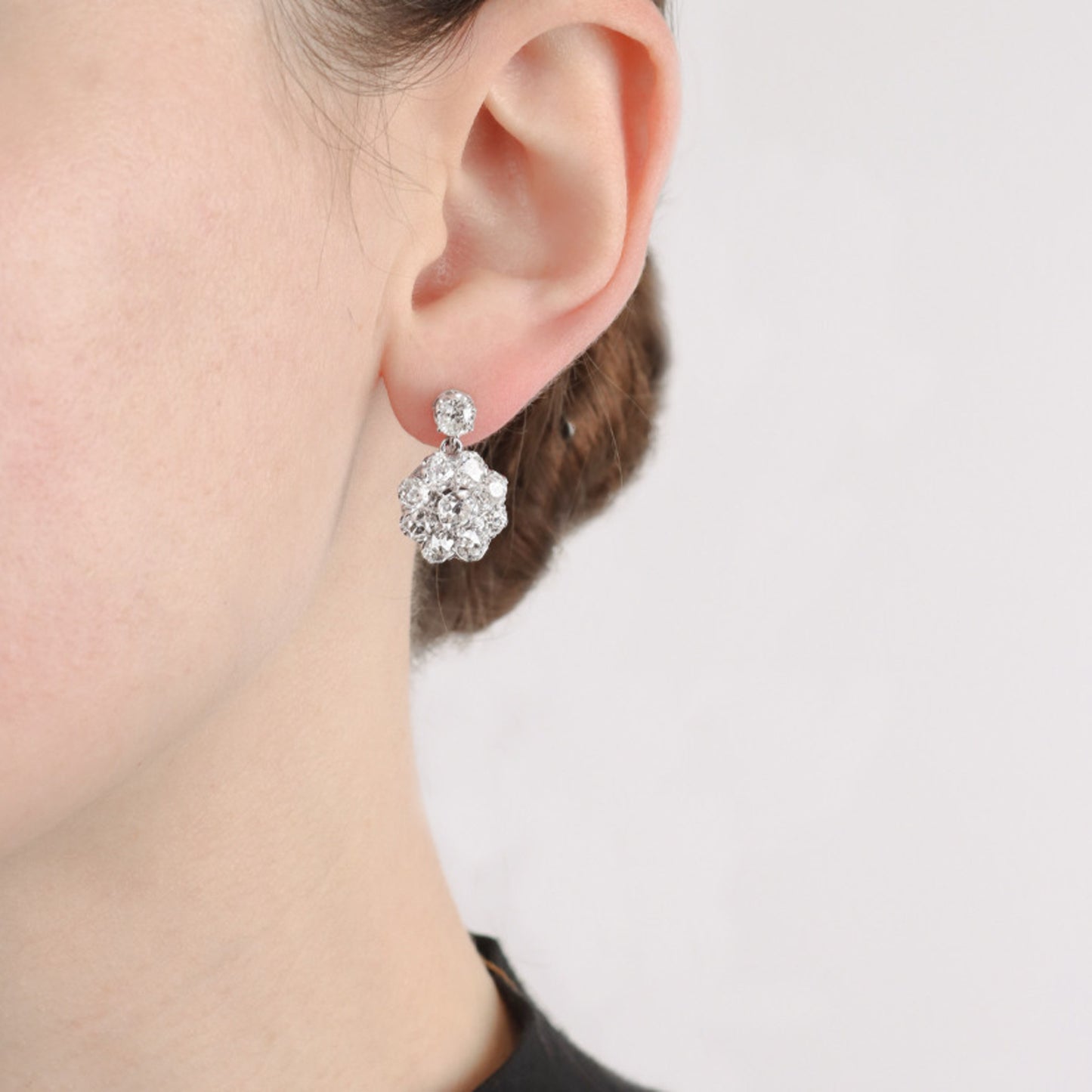 Art Deco Platinum & 18KT White Gold Diamond Earrings on ear