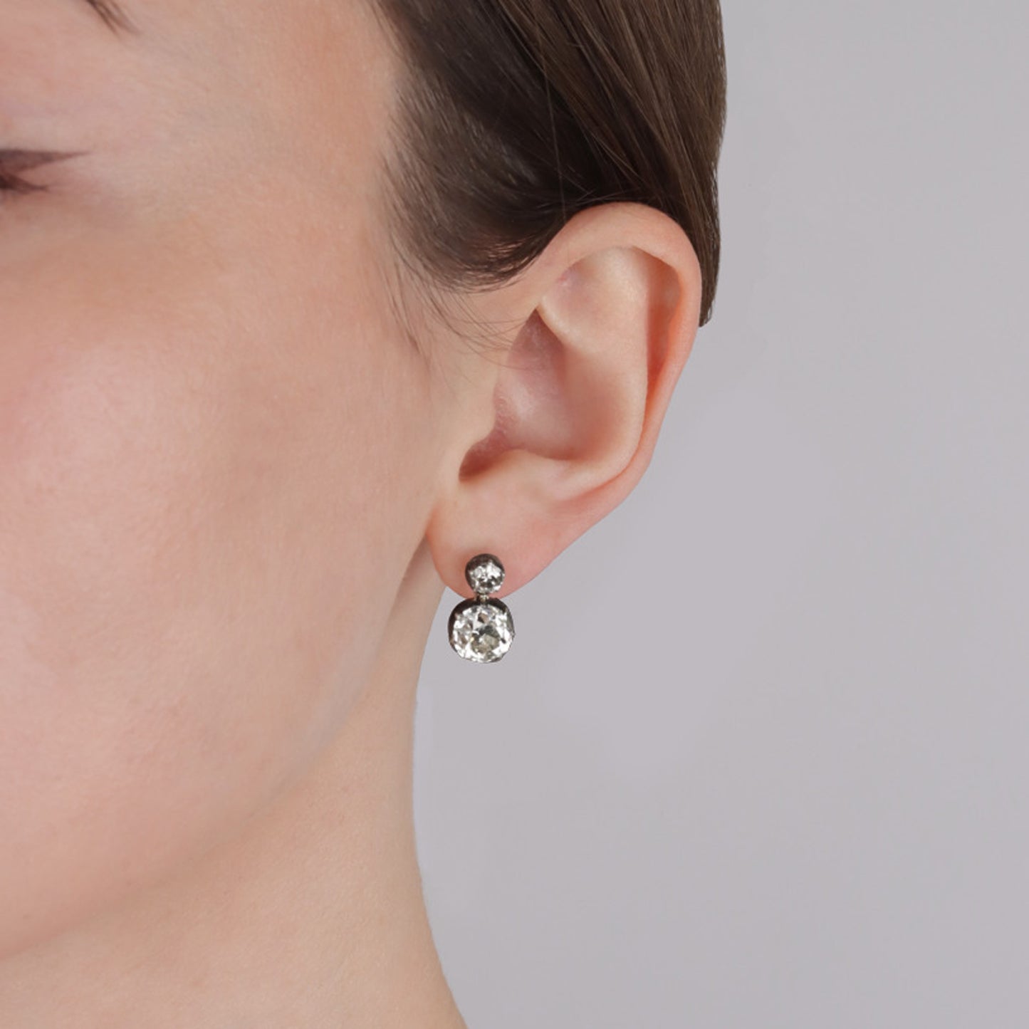 Victorian Silver & 18KT Yellow Gold Diamond Earrings on ear