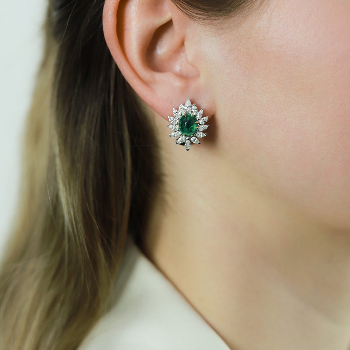 1970s Platinum & 18KT Yellow Gold Emerald & Diamond Earrings on ear