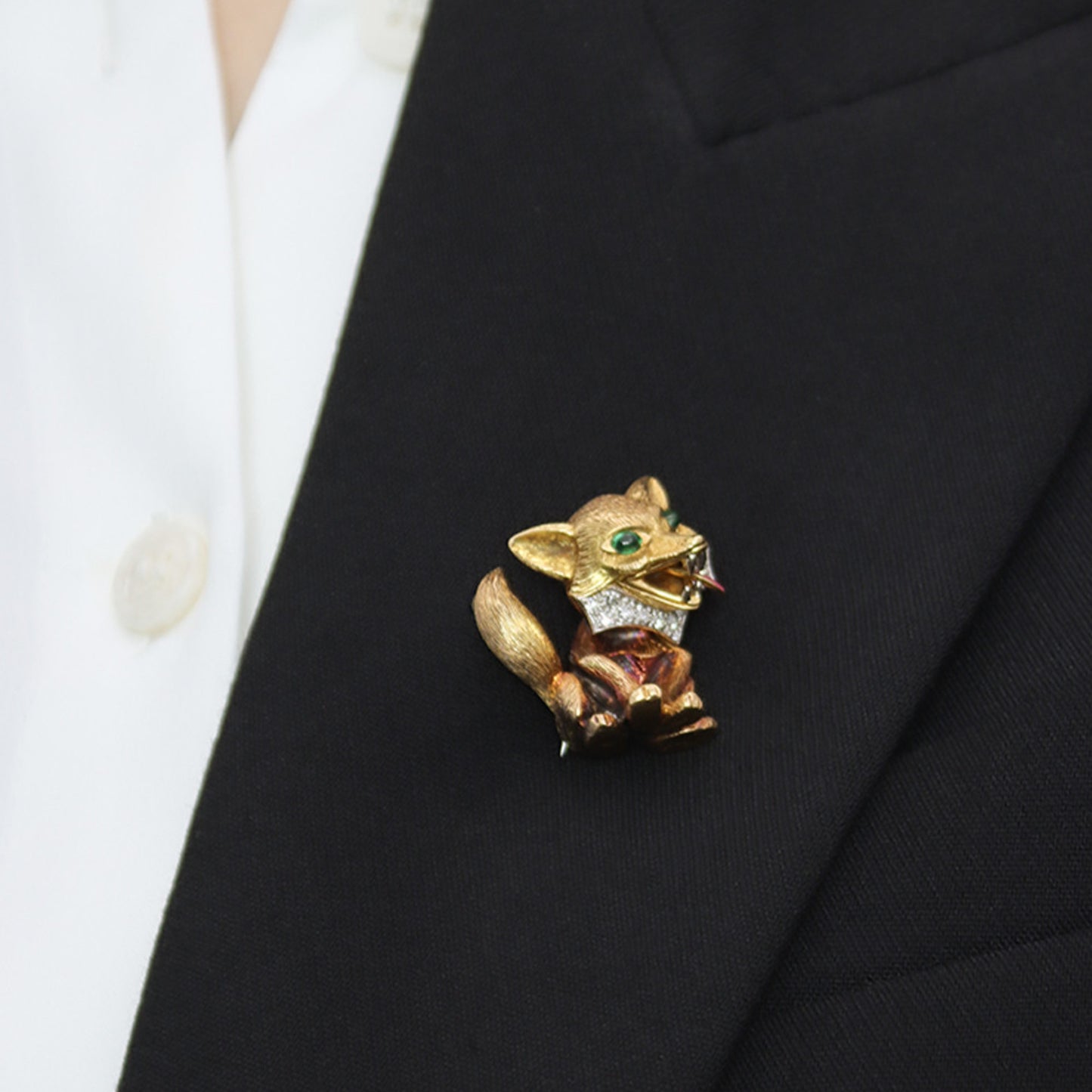 Cartier London 1960s Platinum & 18KT Yellow Gold Emerald, Diamond & Enamel Fox Brooch on lapel