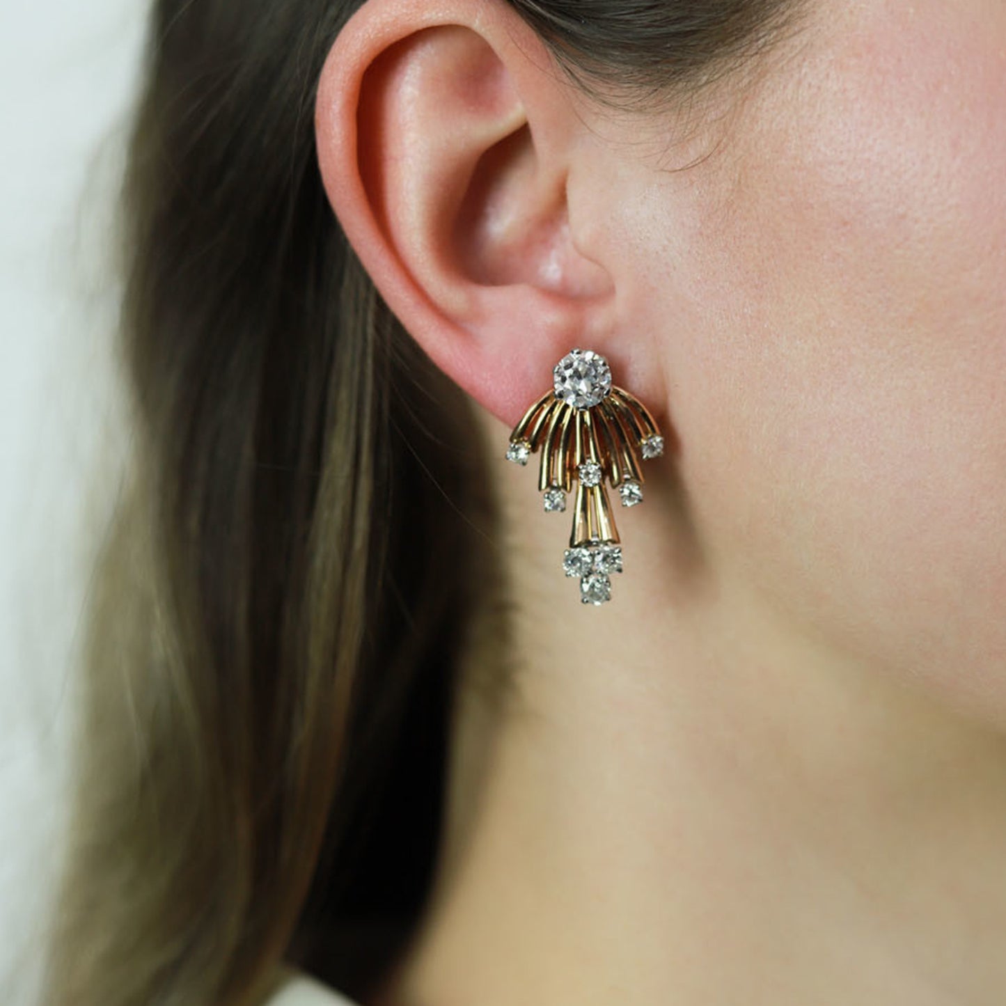 French 1950s Platinum & 18KT Yellow Gold Diamond Earrings on ear