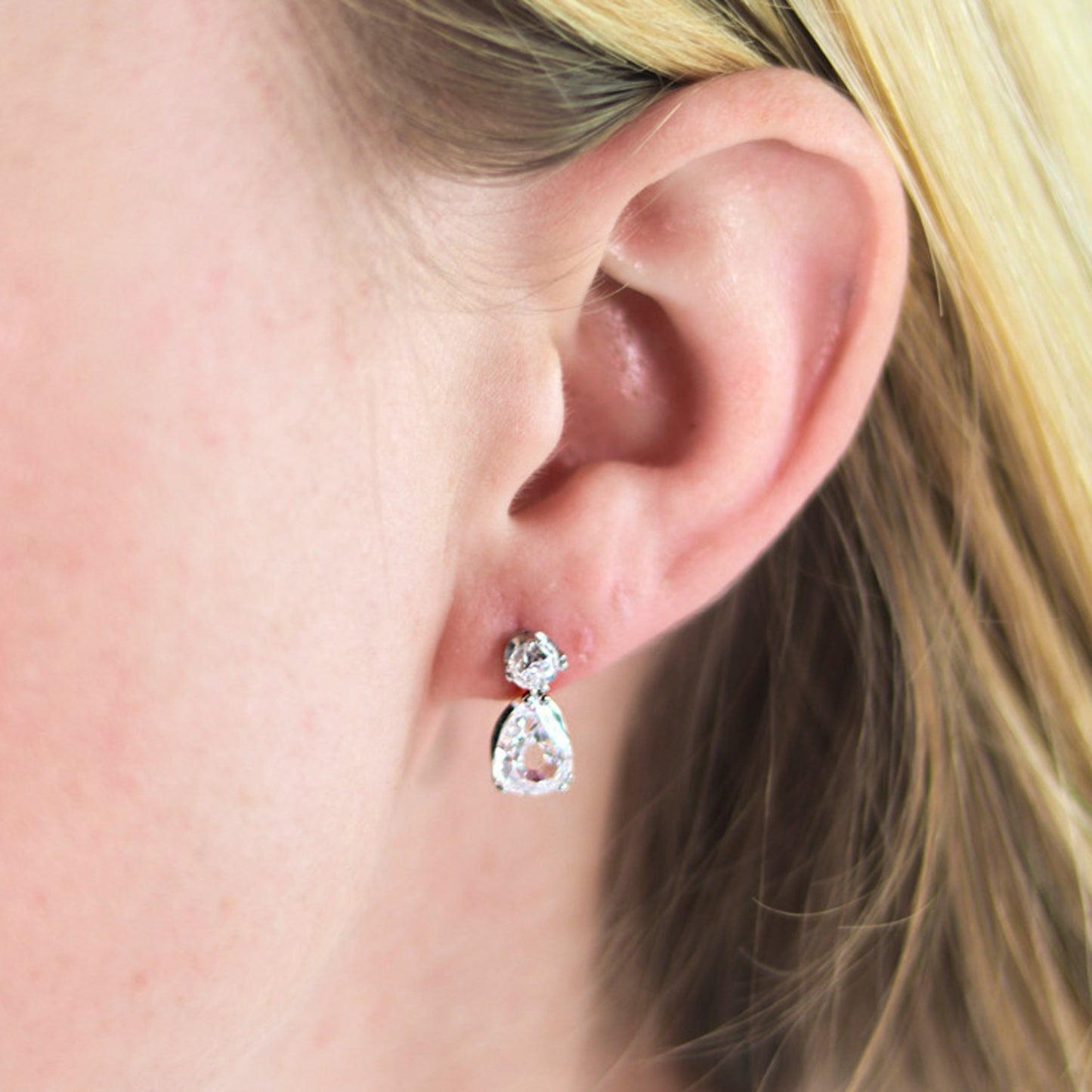 Art Deco Platinum Diamond Earrings on ear