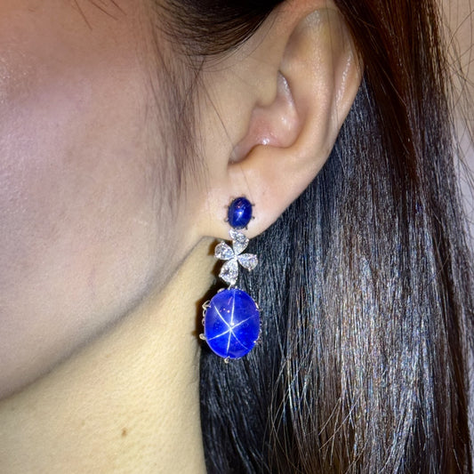 Contemporary 18KT White Gold Star Sapphire & Diamond Earrings on ear