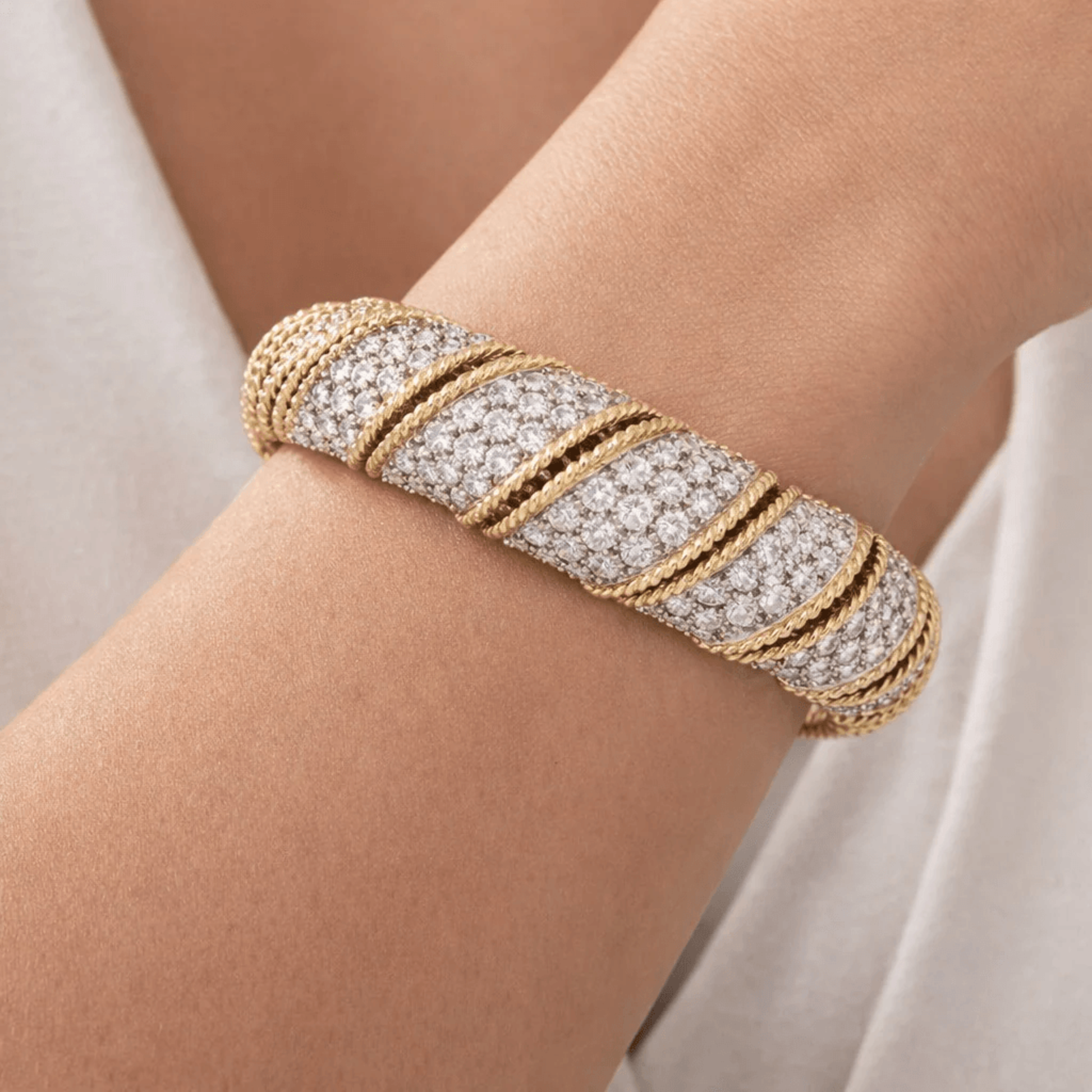 Contemporary 18KT Yellow Gold Diamond Bracelet on wrist
