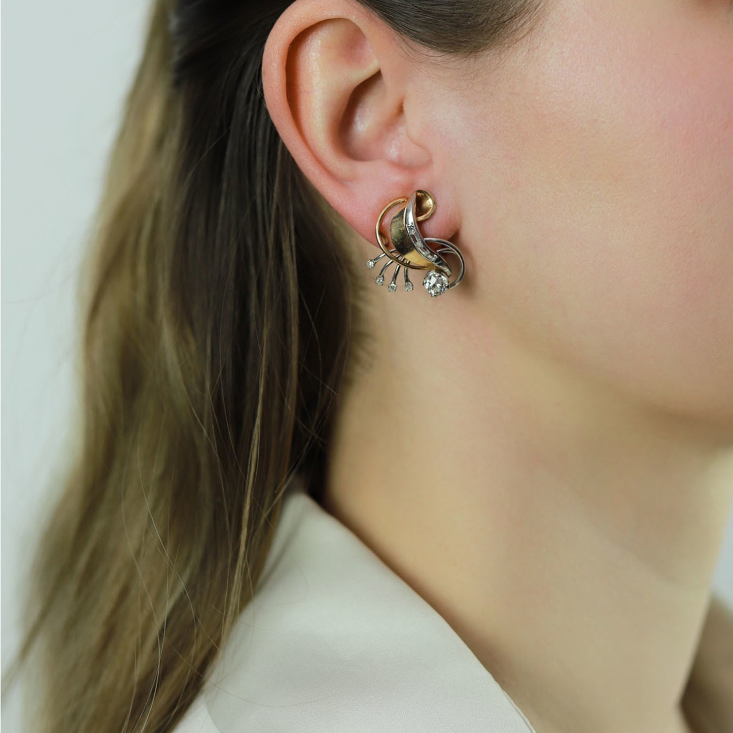 French 1950s Platinum & 18KT Yellow Gold Diamond Earrings on ear
