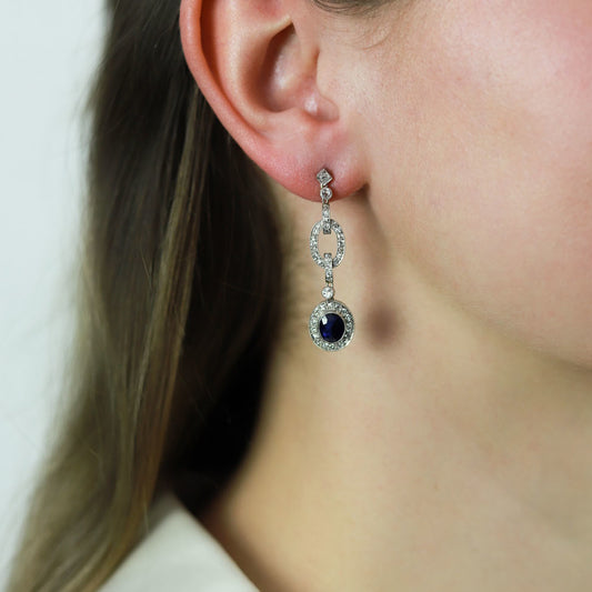 Art Deco Platinum Sapphire & Diamond Earrings on ear