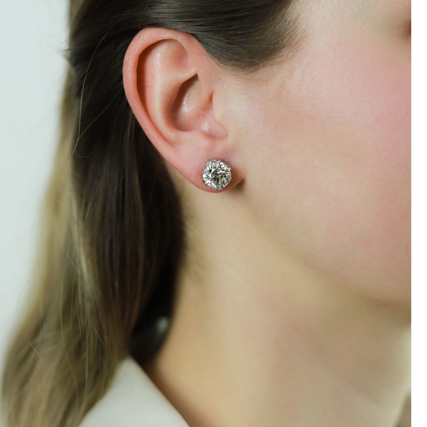 Art Deco Platinum Diamond Earrings on ear