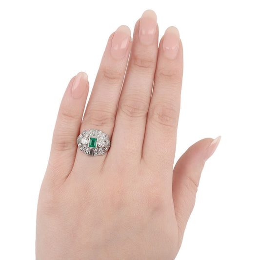 M. Waslikoff & Sons Art Deco Platinum Emerald & Diamond Ring on finger