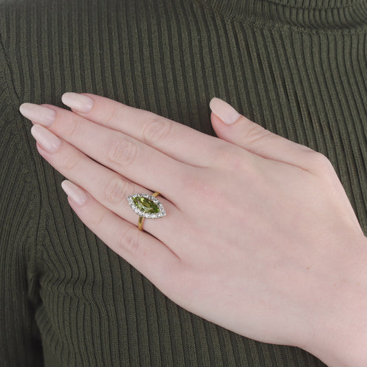 Victorian Platinum & 18KT Yellow Gold Peridot & Diamond Ring on finger
