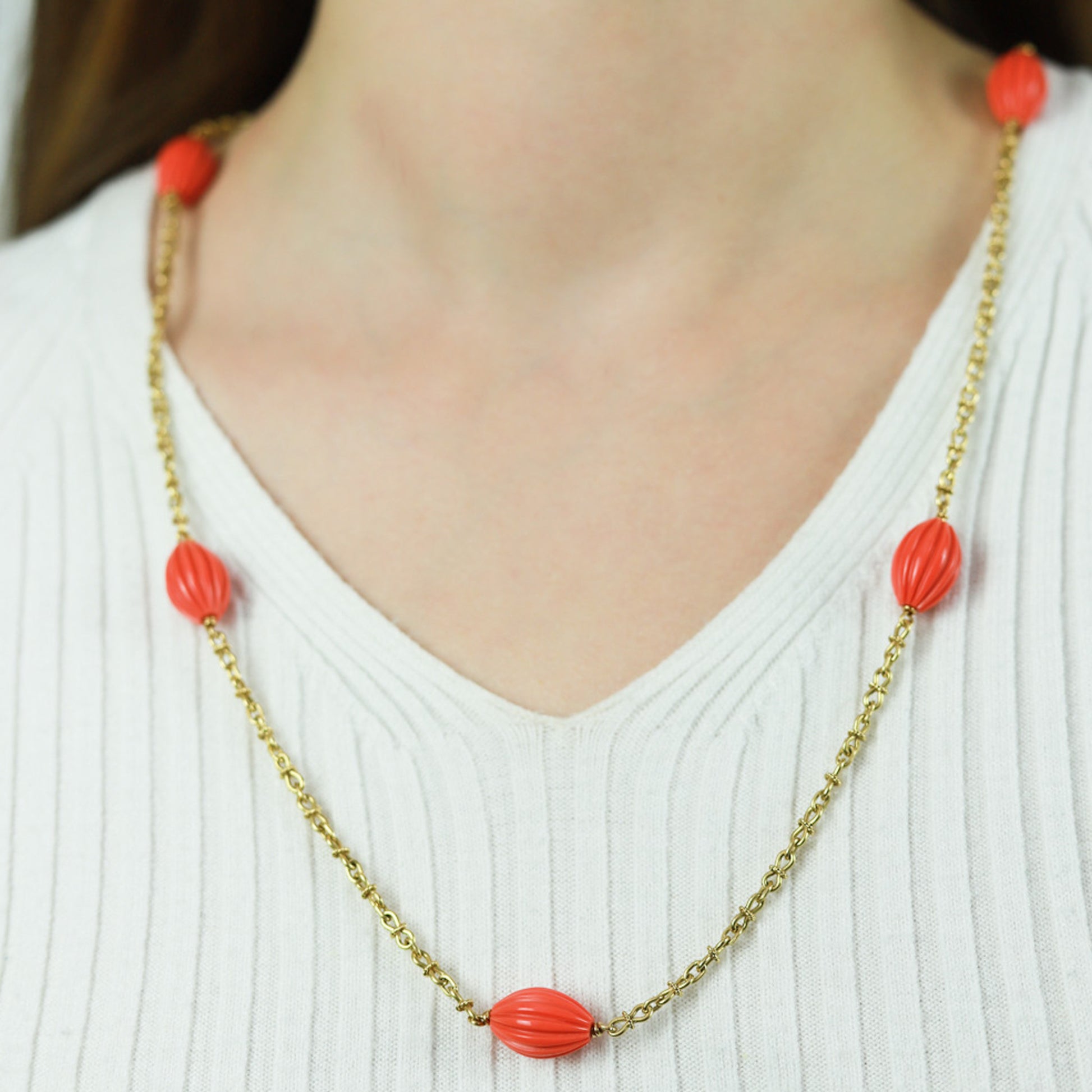French 1970s 18KT Yellow Gold Coral Necklace on neck