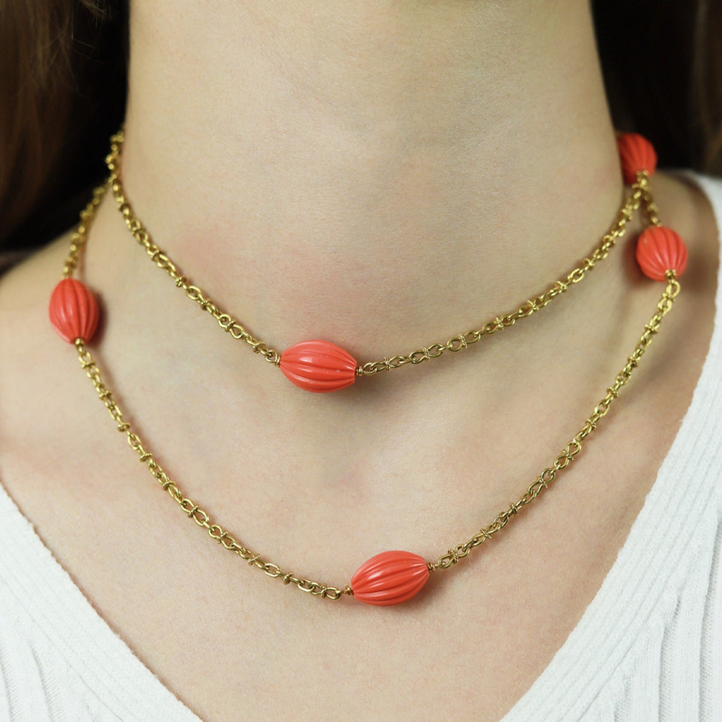French 1970s 18KT Yellow Gold Coral Necklace on neck