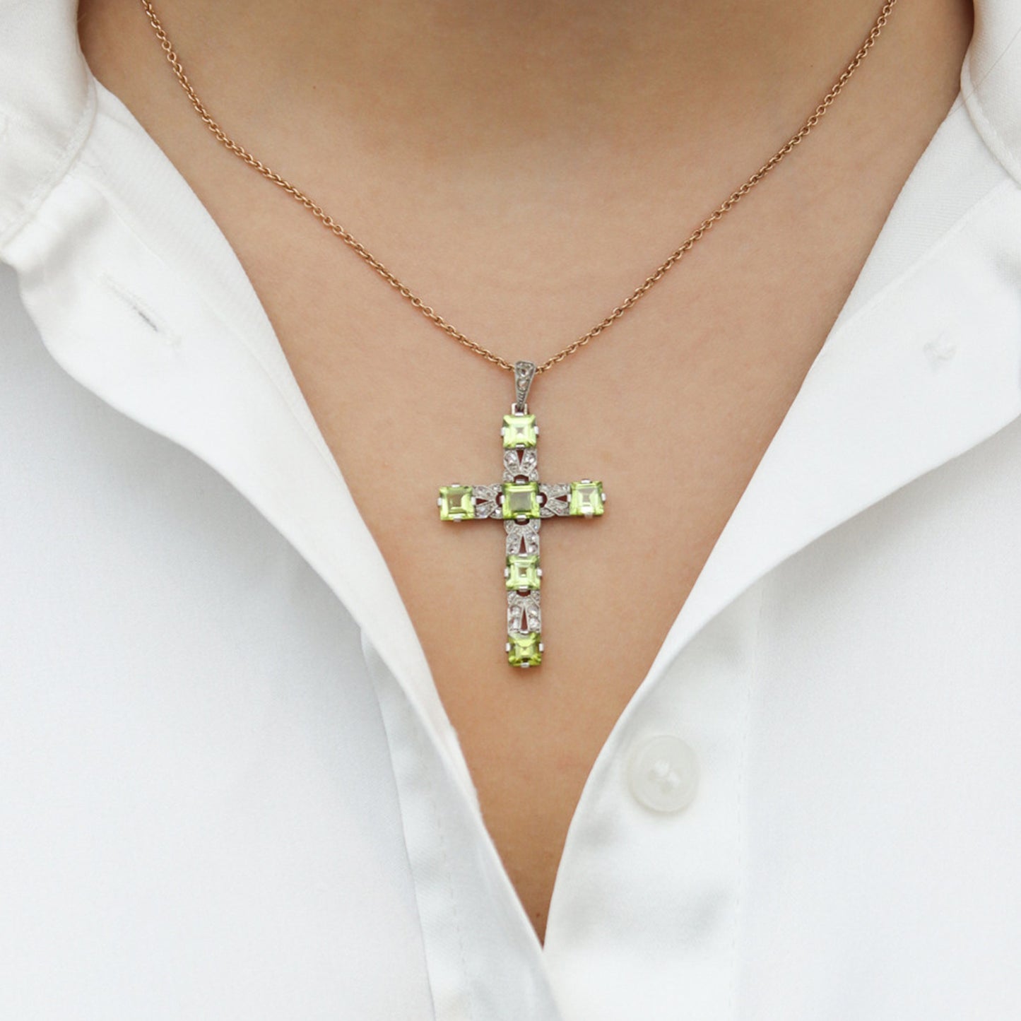 Art Deco Platinum & 18KT White Gold Peridot & Diamond Cross Pendant on neck