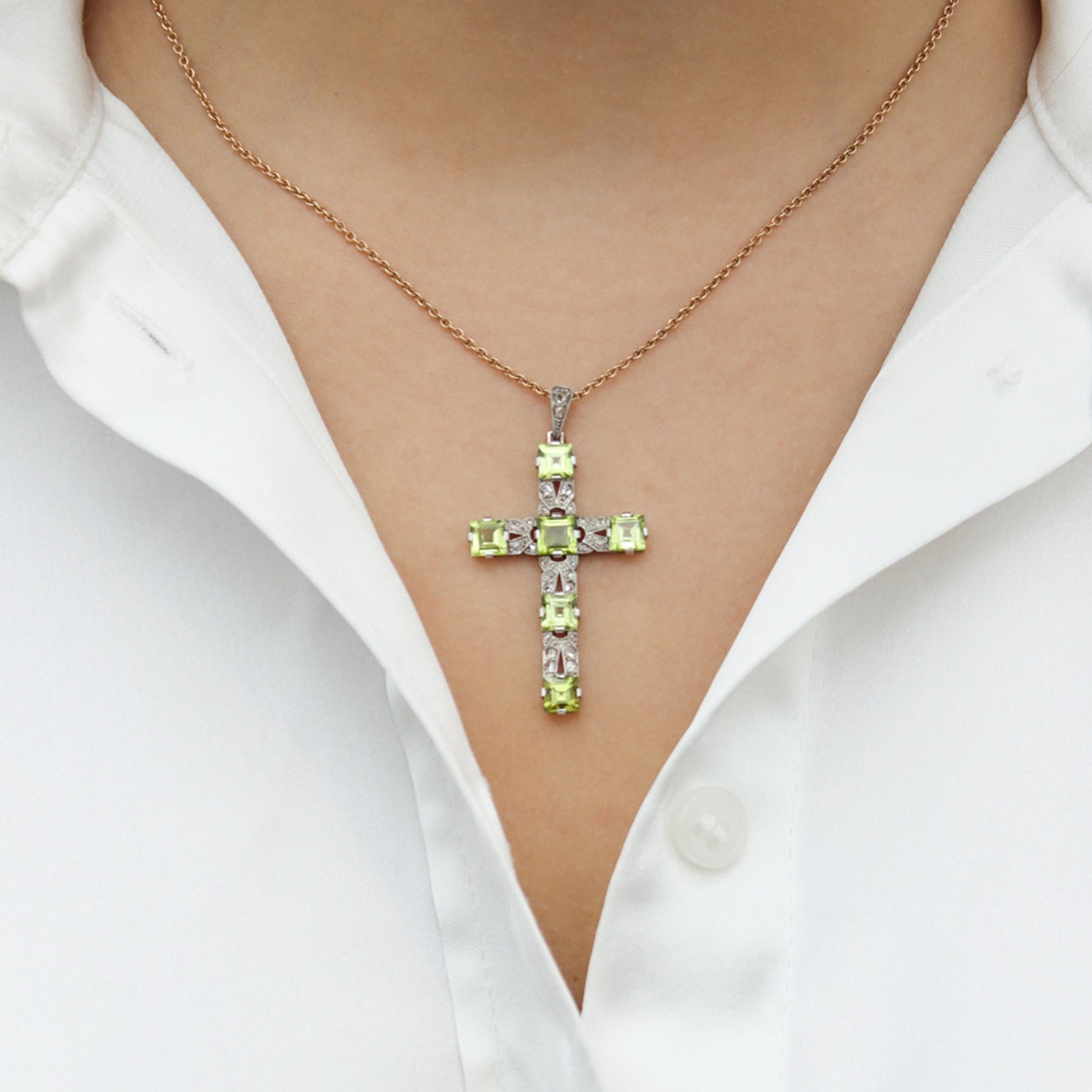 Art Deco Platinum & 18KT White Gold Peridot & Diamond Cross Pendant on neck