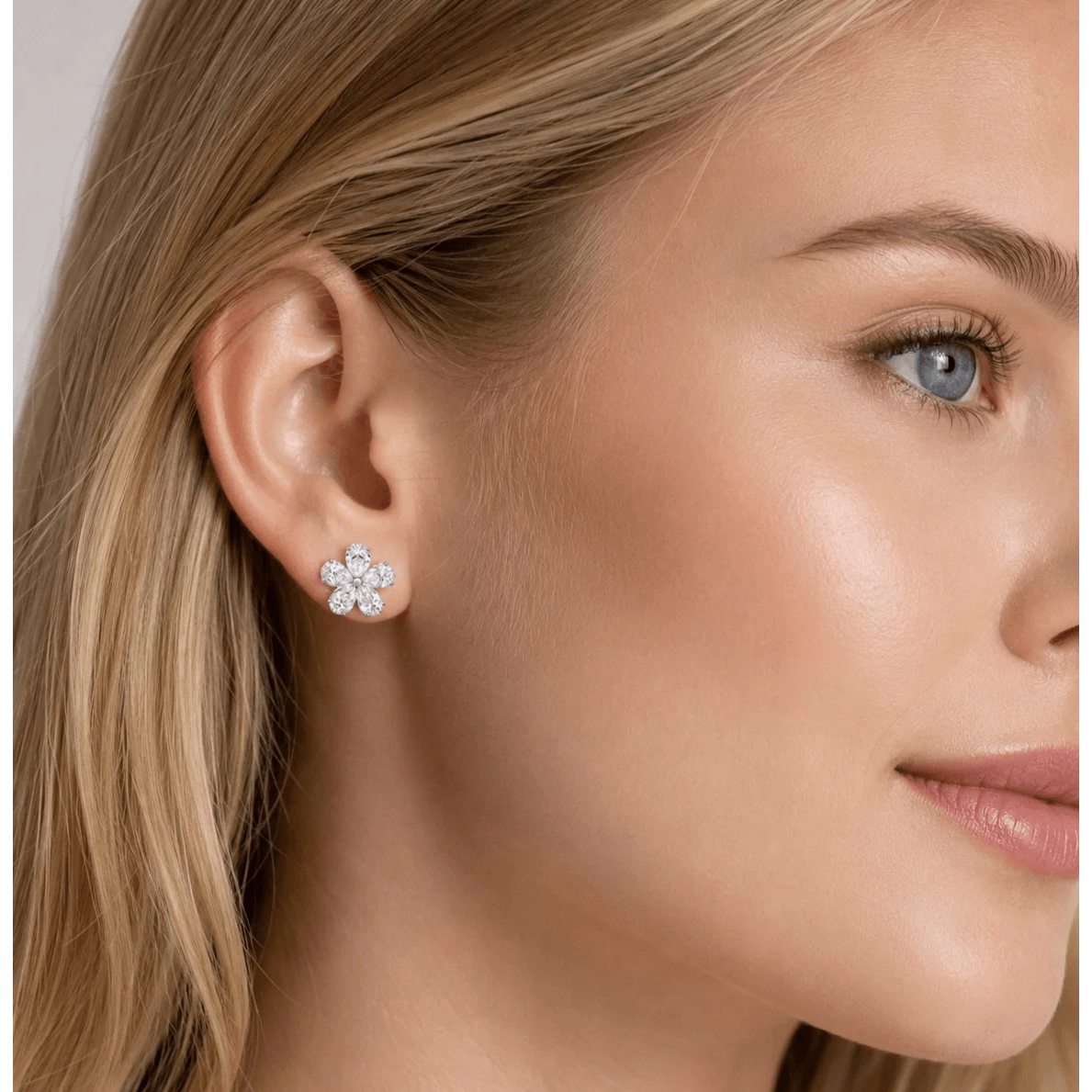 Contemporary Platinum Diamond Earrings on ear
