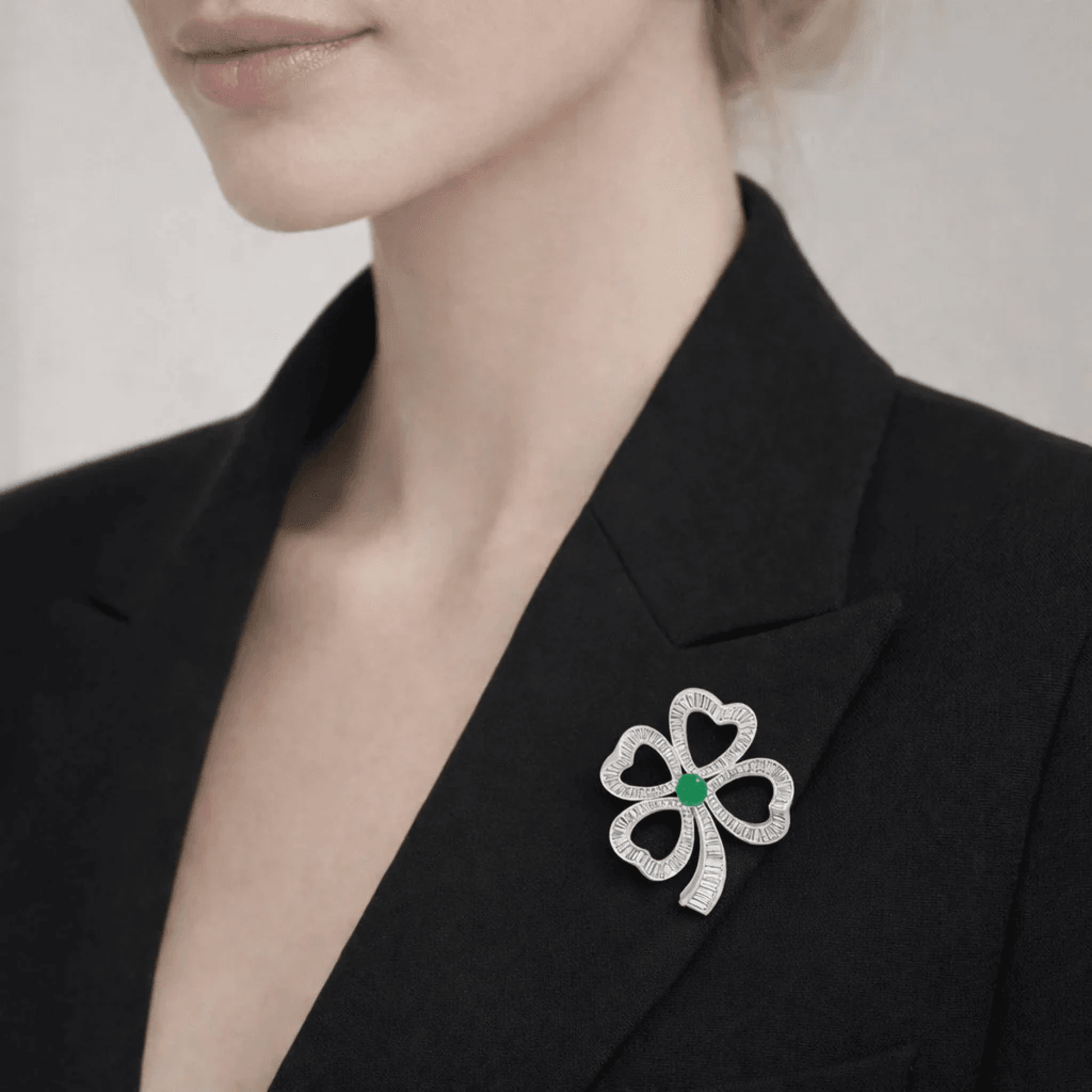 Post-1980s Platinum Emerald & Diamond Brooch on lapel