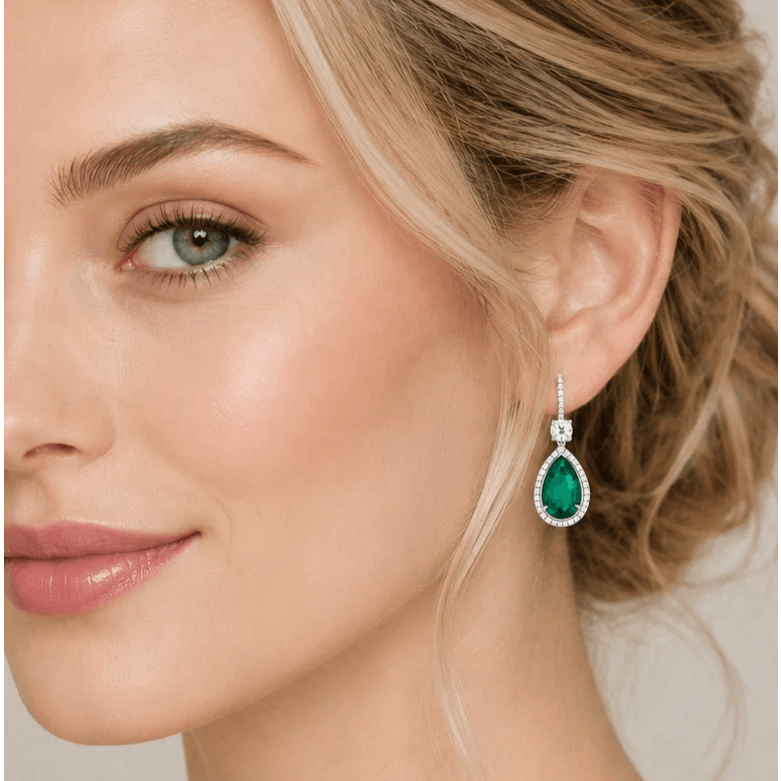 Contemporary 18KT White Gold Emerald & Diamond Earrings on ear