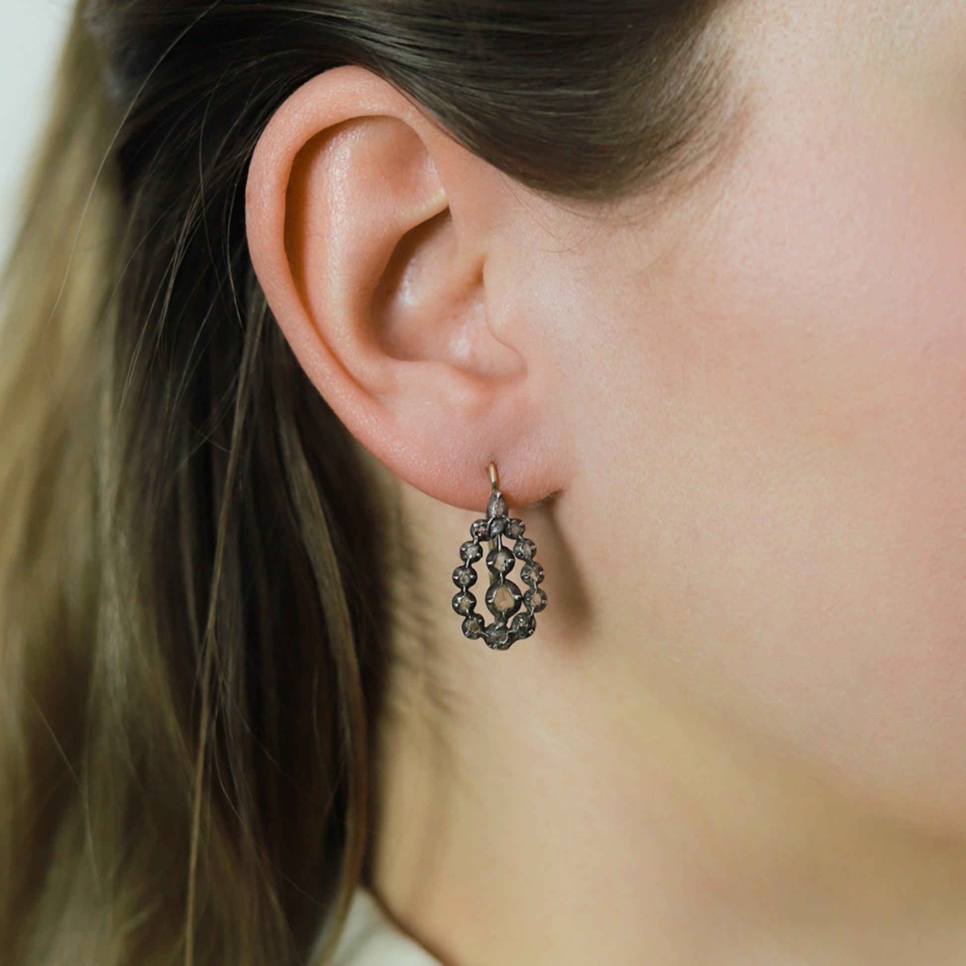 English Victorian Silver & 18KT Yellow Gold Diamond Earrings on ear