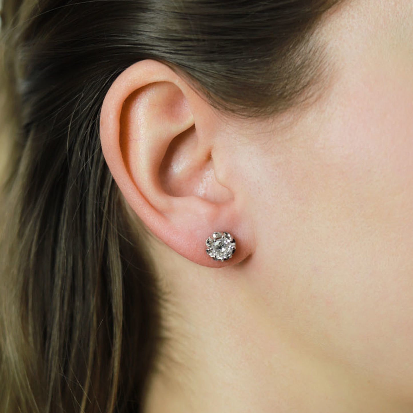 1950s Platinum Diamond Earrings on ear