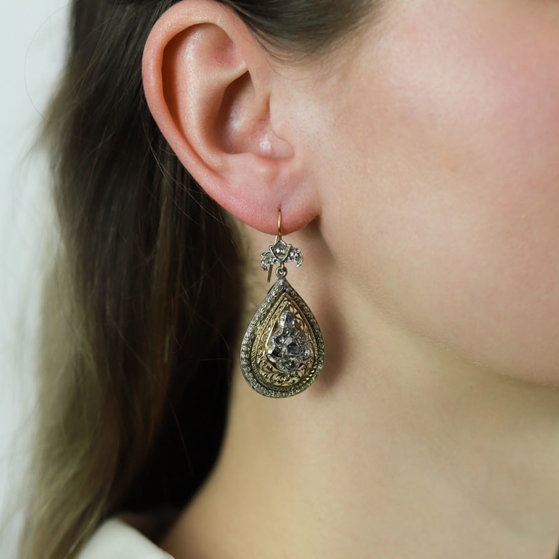 Victorian Silver & 18KT Yellow Gold Diamond Earrings on ear