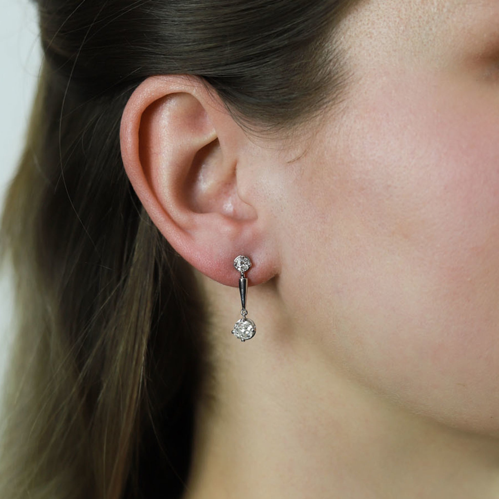Art Deco 18KT White Gold Diamond Earrings on ear