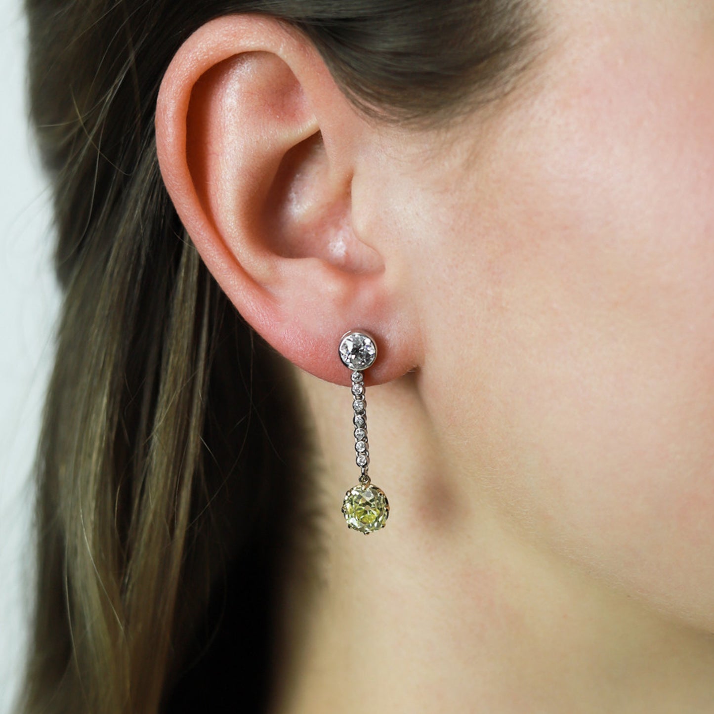Edwardian Platinum, 18KT White & Yellow Gold Diamond Earrings on ear