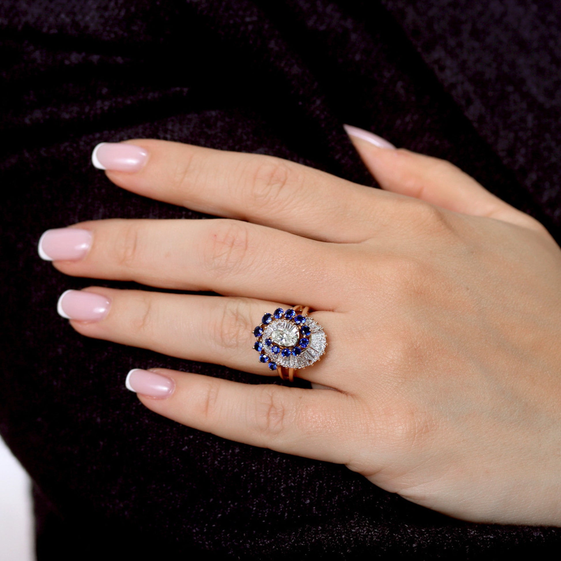 Oscar Heyman Bros. American 1970s Platinum & 18KT Yellow Gold Diamond & Sapphire Ring on finger