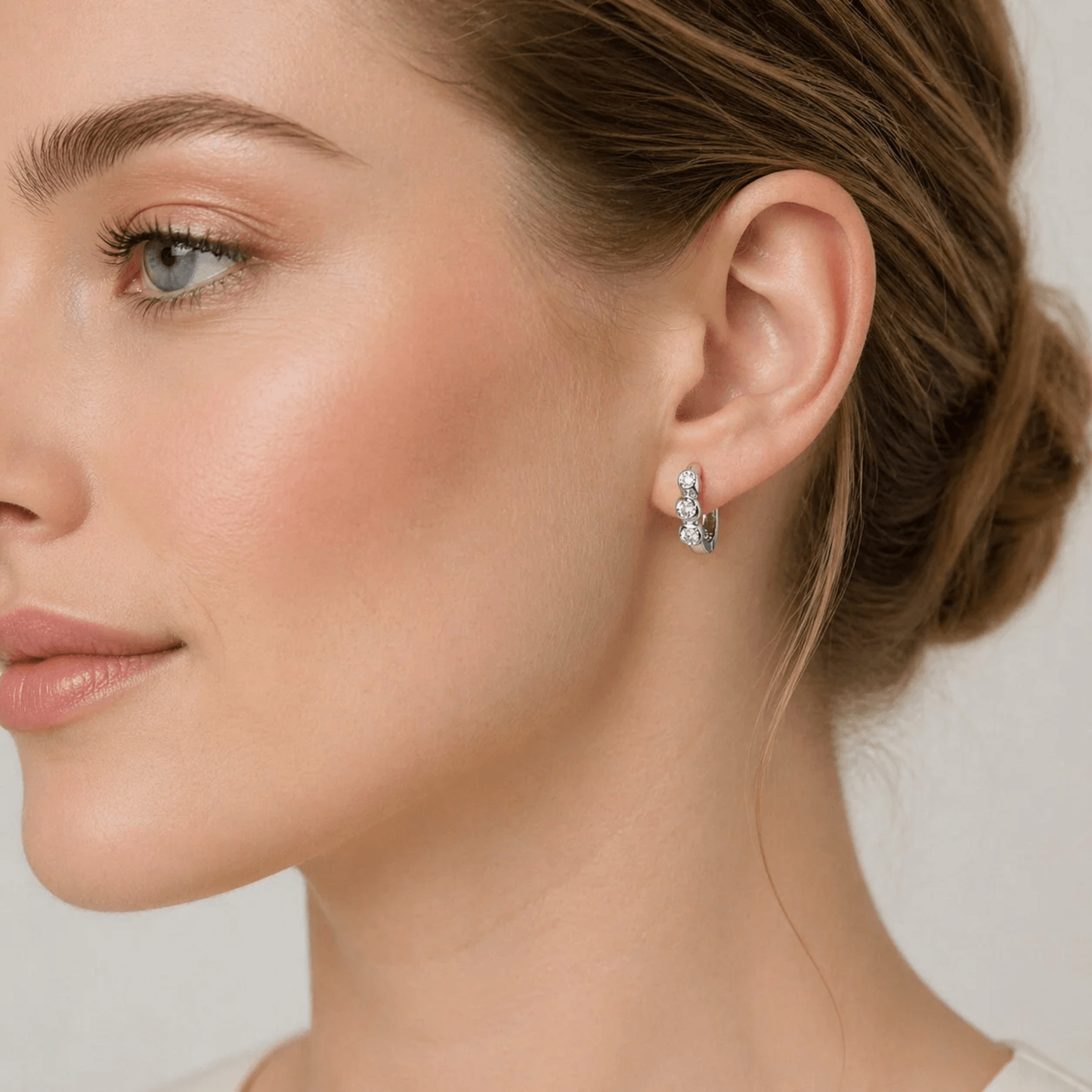 Contemporary 14KT White Gold Diamond Earrings on ear