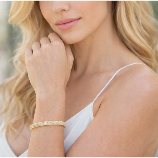 Contemporary 18KT Yellow Gold Diamond Bracelet on wrist