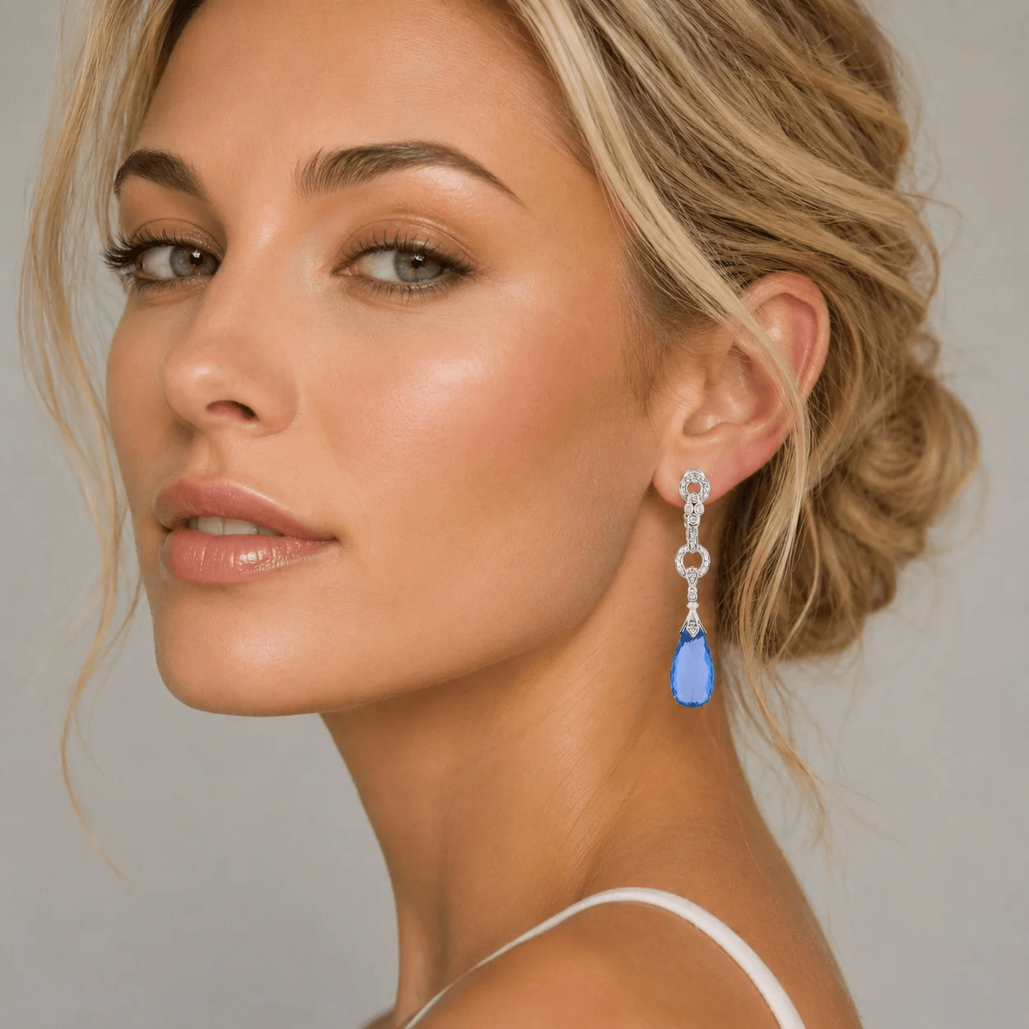 Contemporary 14KT White Gold Topaz & Diamond Earrings on ear