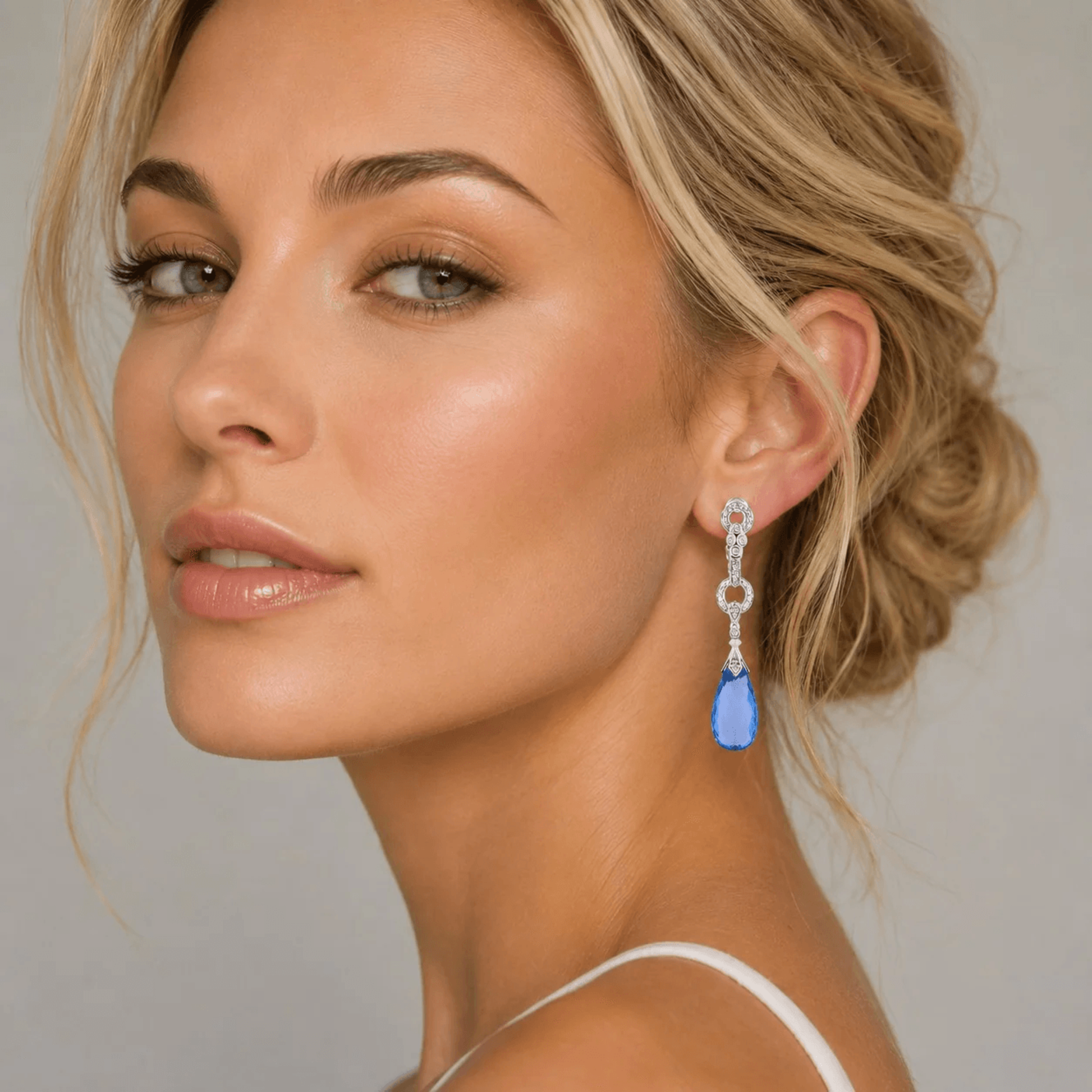 Contemporary 14KT White Gold Topaz & Diamond Earrings on ear