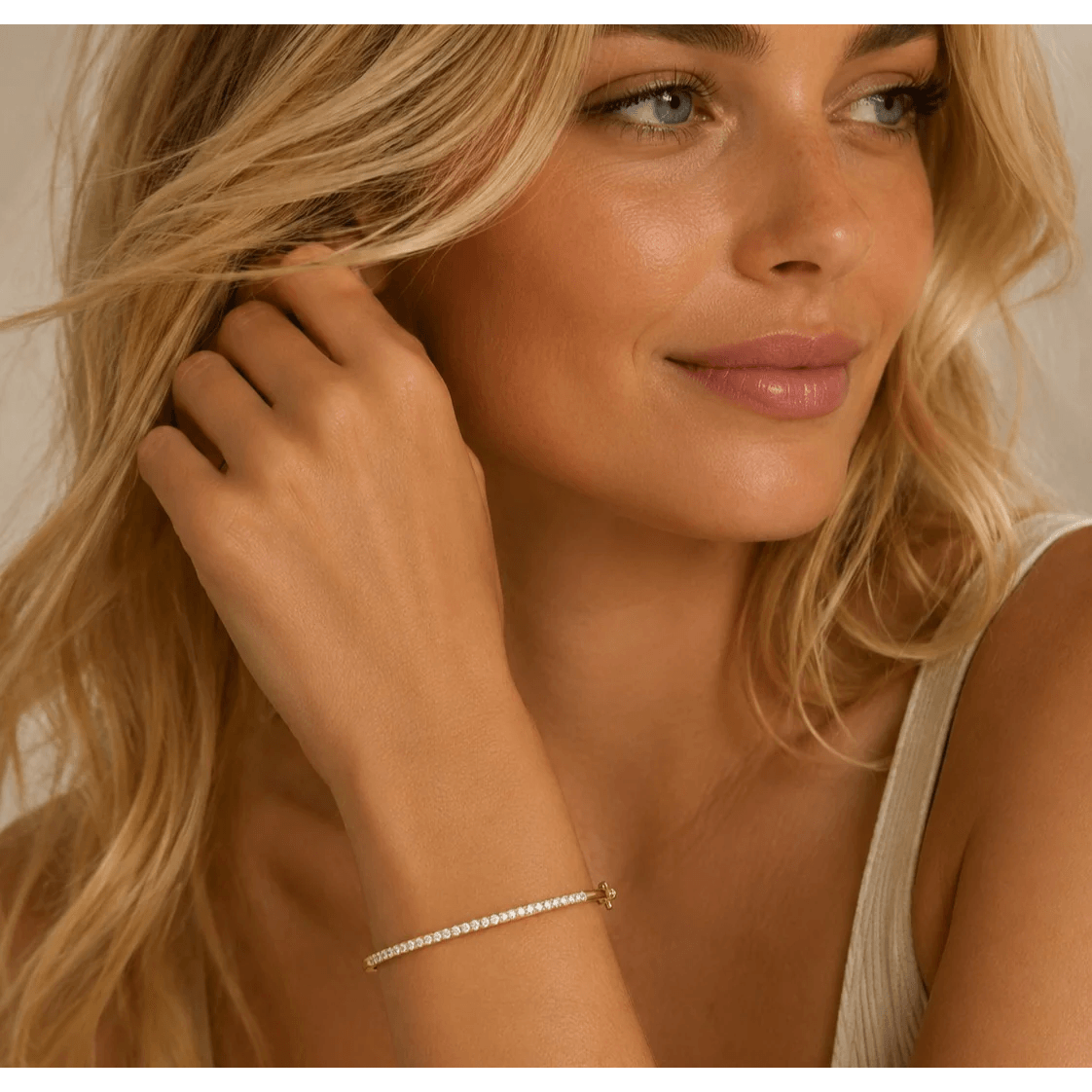 Contemporary 14KT Yellow Gold Diamond Bracelet on wrist