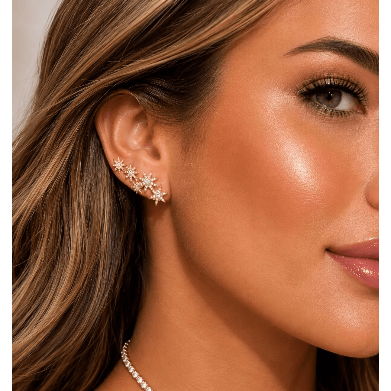 Contemporary 18KT Yellow Gold Diamond Earrings on ear