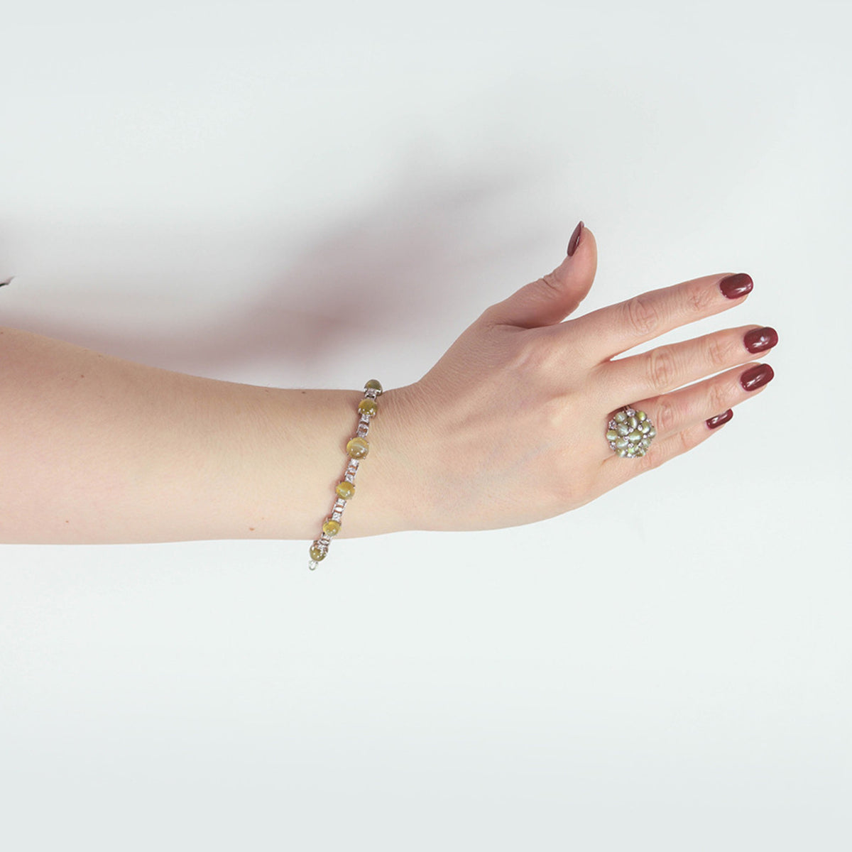 J.E. Caldwell 1930s Platinum Chrysoberyl Cat's Eye & Diamond Bracelet on wrist