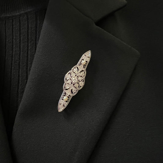 Art Deco Platinum & 18KT Yellow Gold Diamond & Pearl Brooch worn on black collar