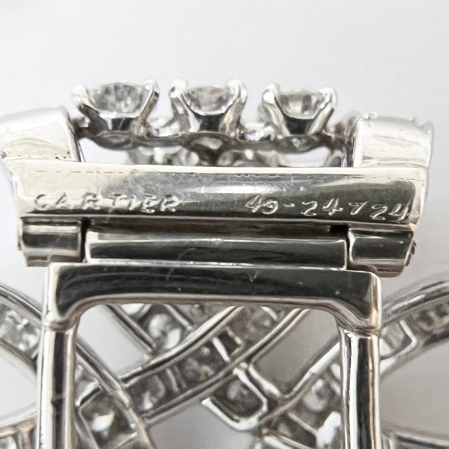 Cartier 1950s Platinum Diamond Brooch close-up details and signature