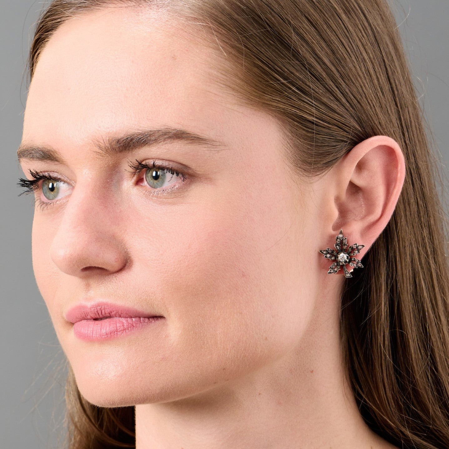 Antique Silver & Yellow Gold Diamond Floral Earrings worn on ear