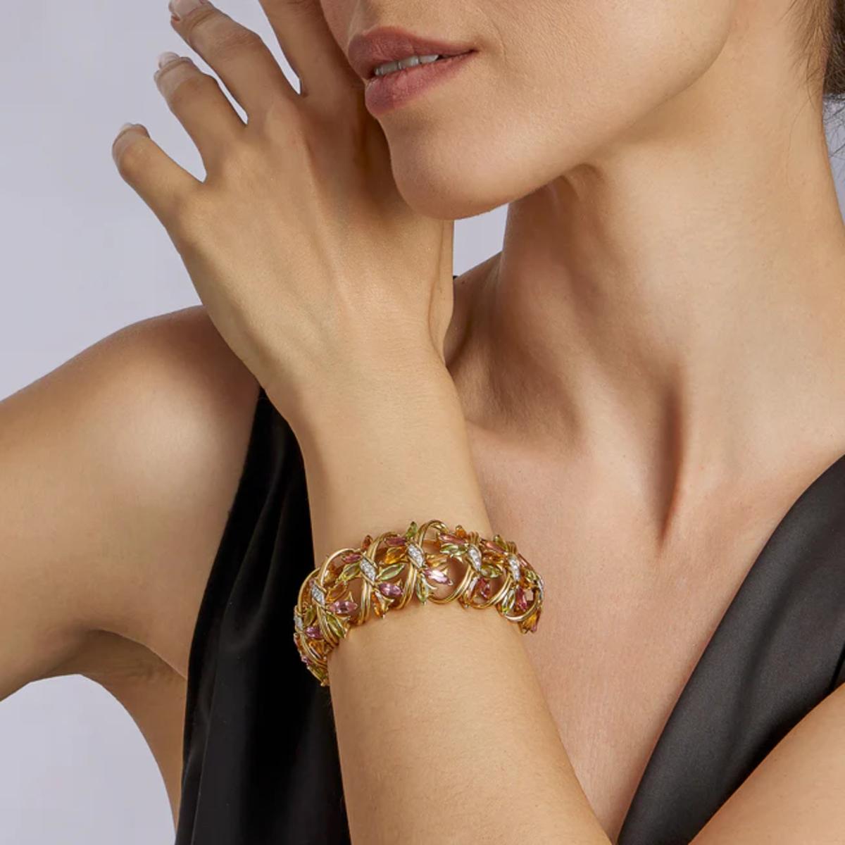 Jean Schlumberger 1960s 18KT Yellow Gold Peridot, Citrine, Diamond & Tourmaline Bracelet worn on wrist