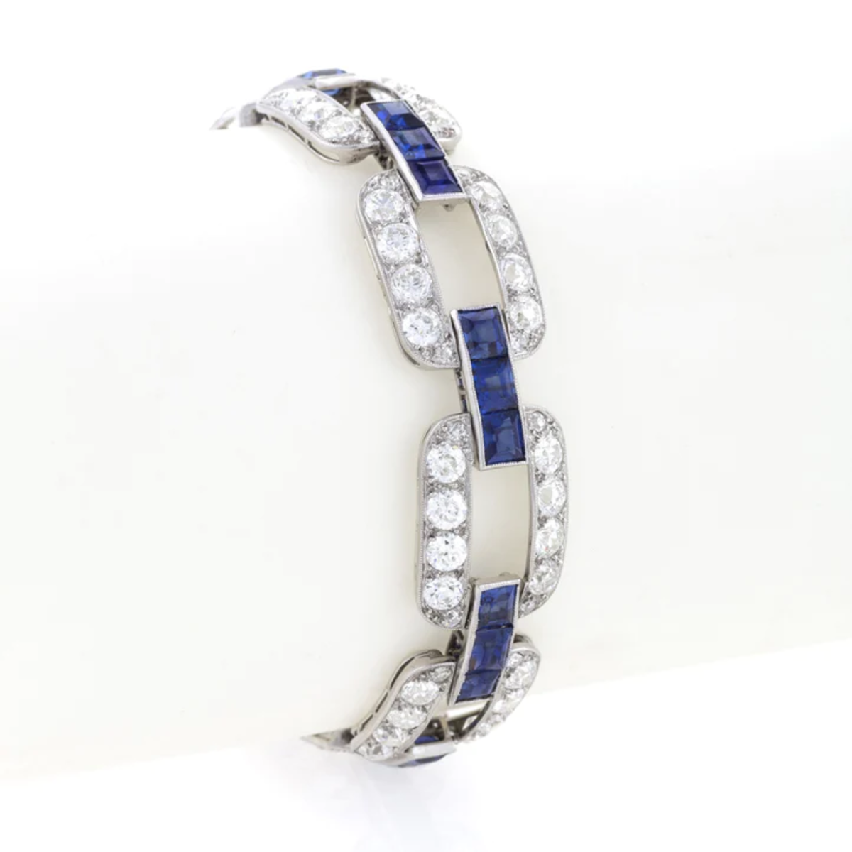 1930s Platinum Sapphire & Diamond Link Bracelet on wrist form