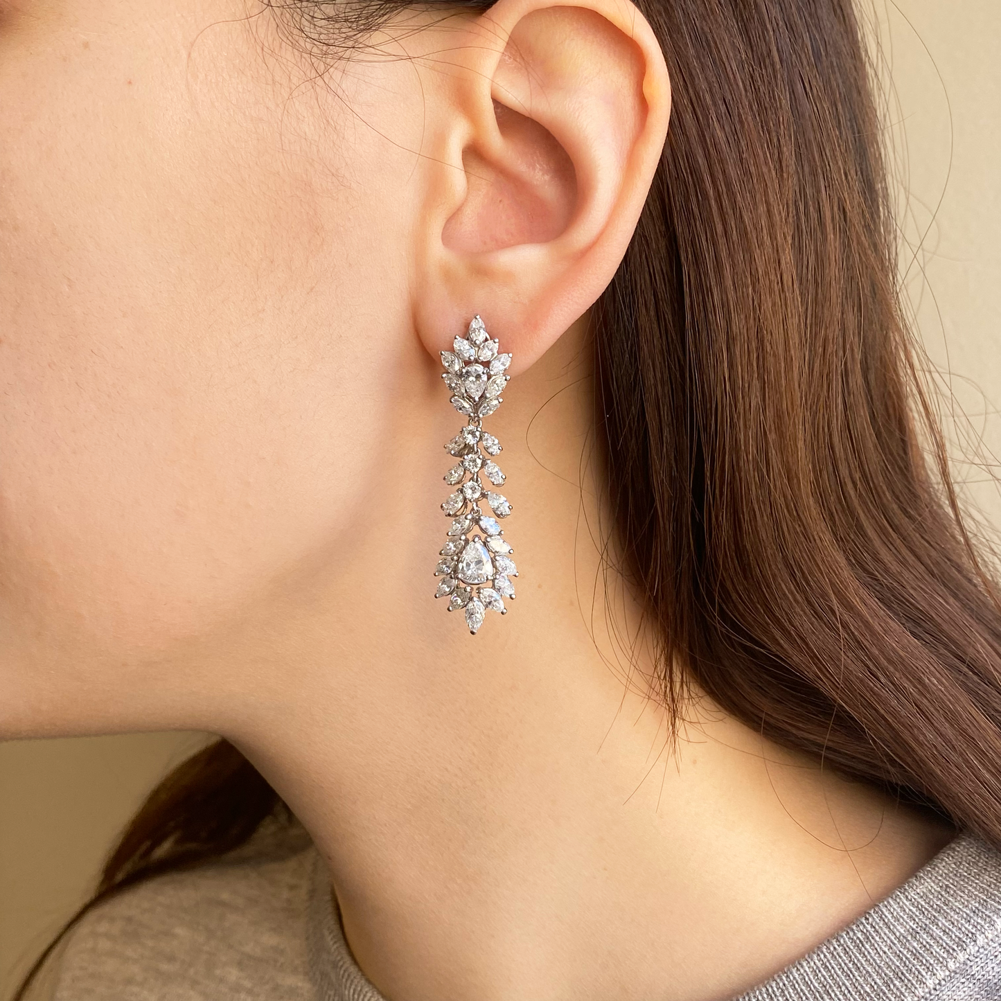 1960s Platinum Diamond Earrings worn on ear