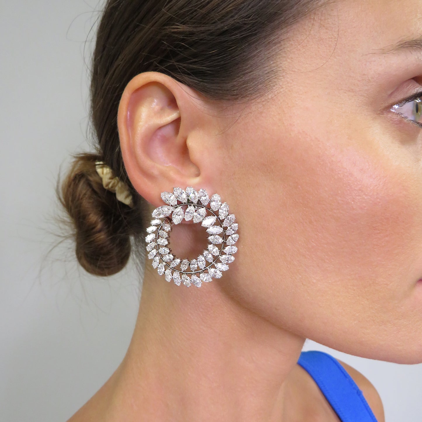 1950s Platinum Diamond Swirl Earrings worn on ear