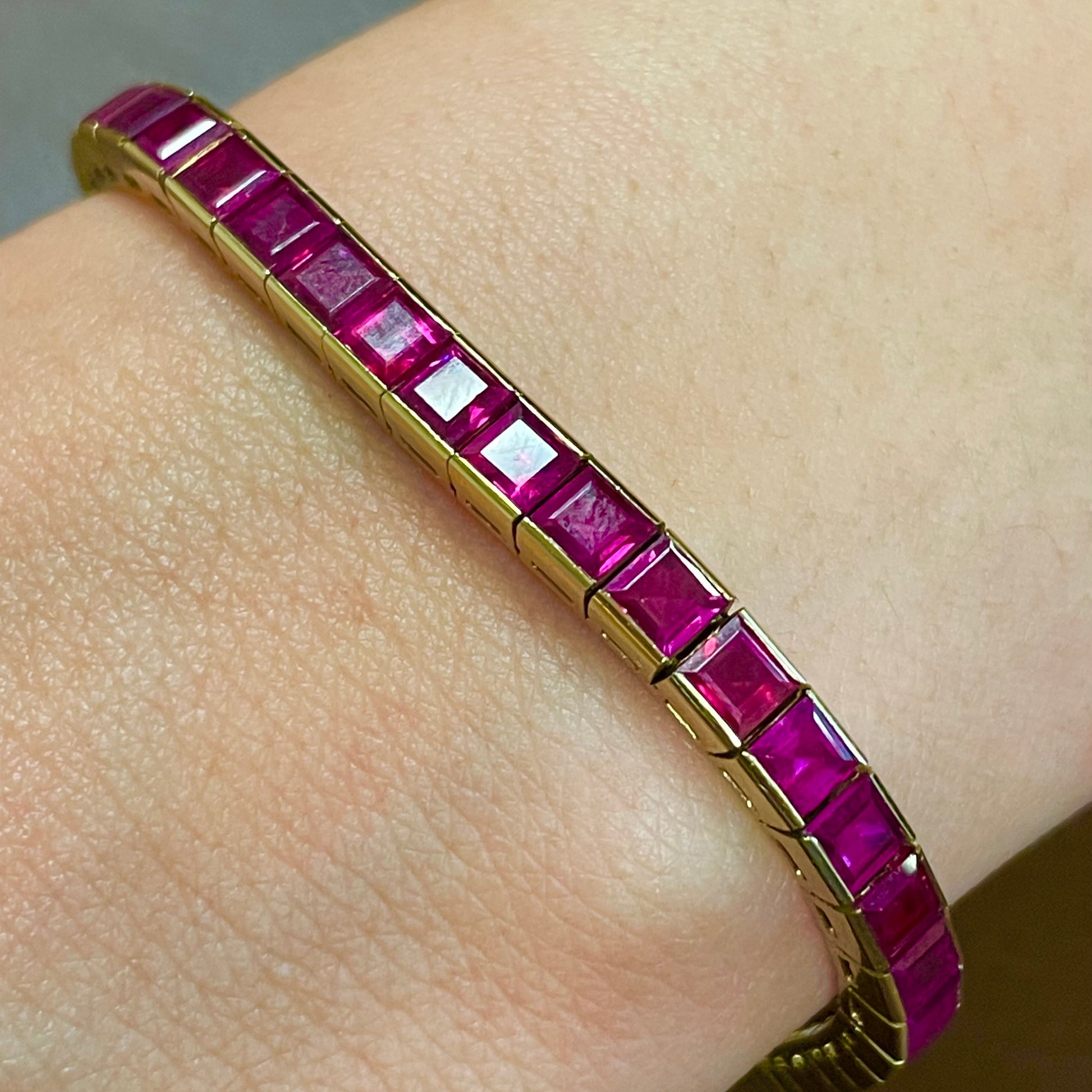 Chaumet 1940s 18KT Yellow Gold Ruby Track Bracelet worn on wrist