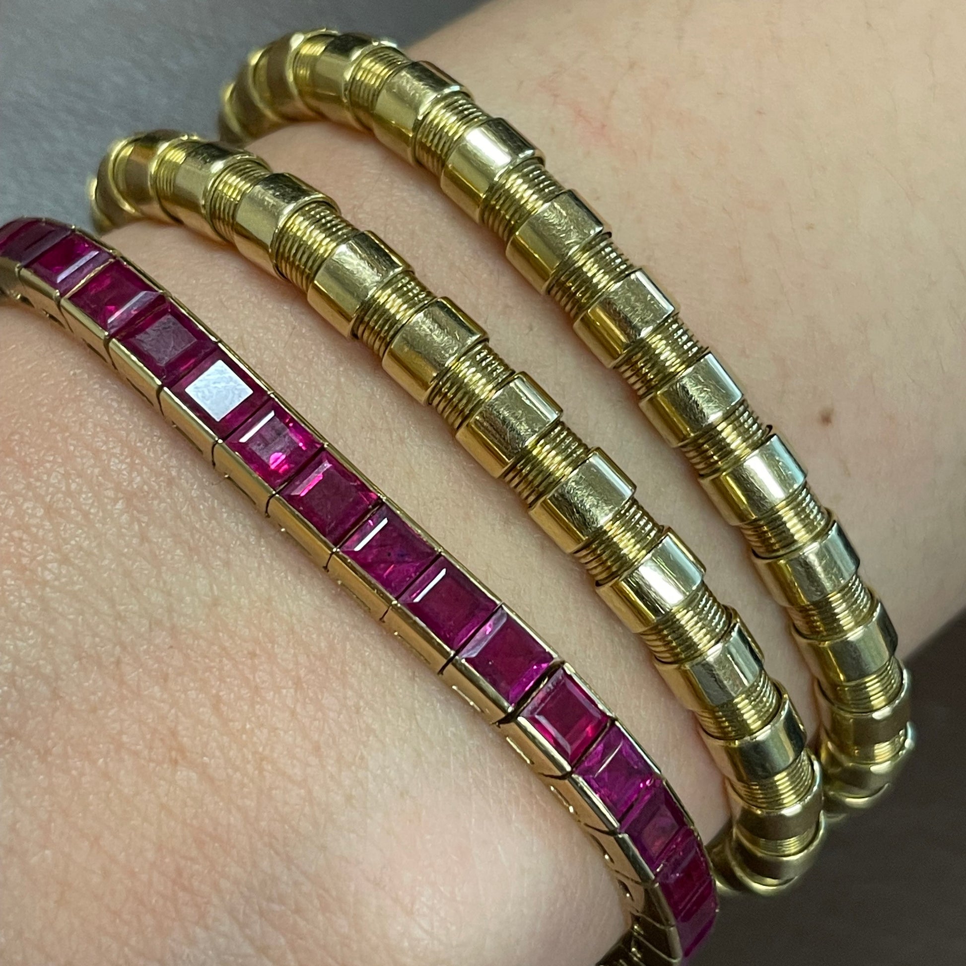 Chaumet 1940s 18KT Yellow Gold Ruby Track Bracelet worn on wrist