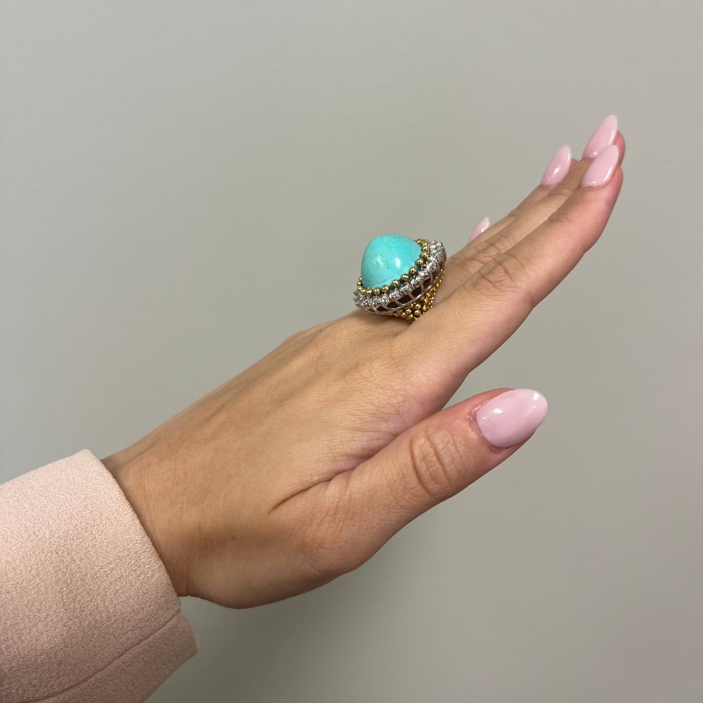 1970s 18KT Yellow Gold Turquoise & Diamond Cocktail Ring side view worn on hand