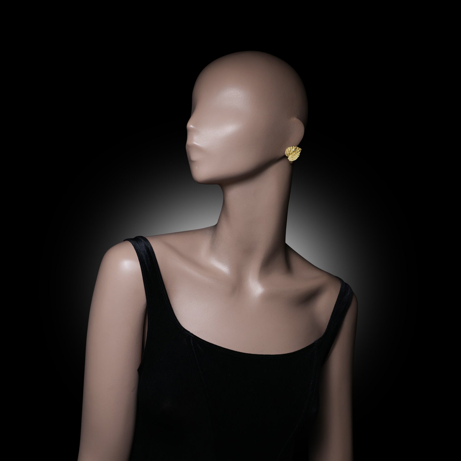 Andrew Grima 1960s 18KT Yellow Gold Diamond Cyclamen Leaf Earrings worn on ear